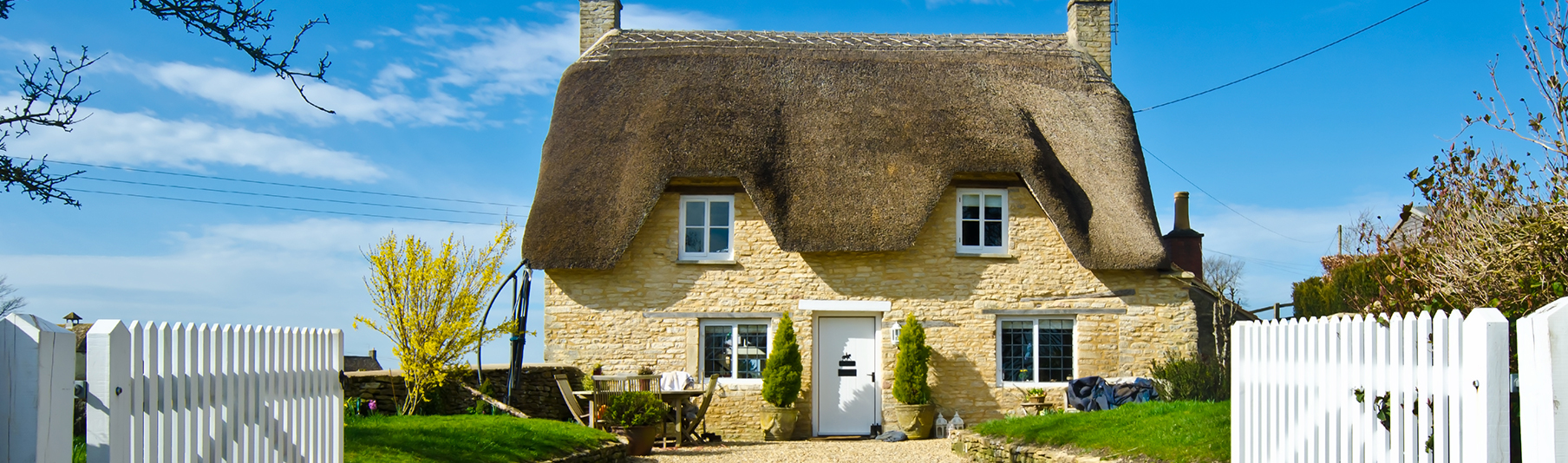 Household Insurance: A picturesque yellow cottage in the countryside