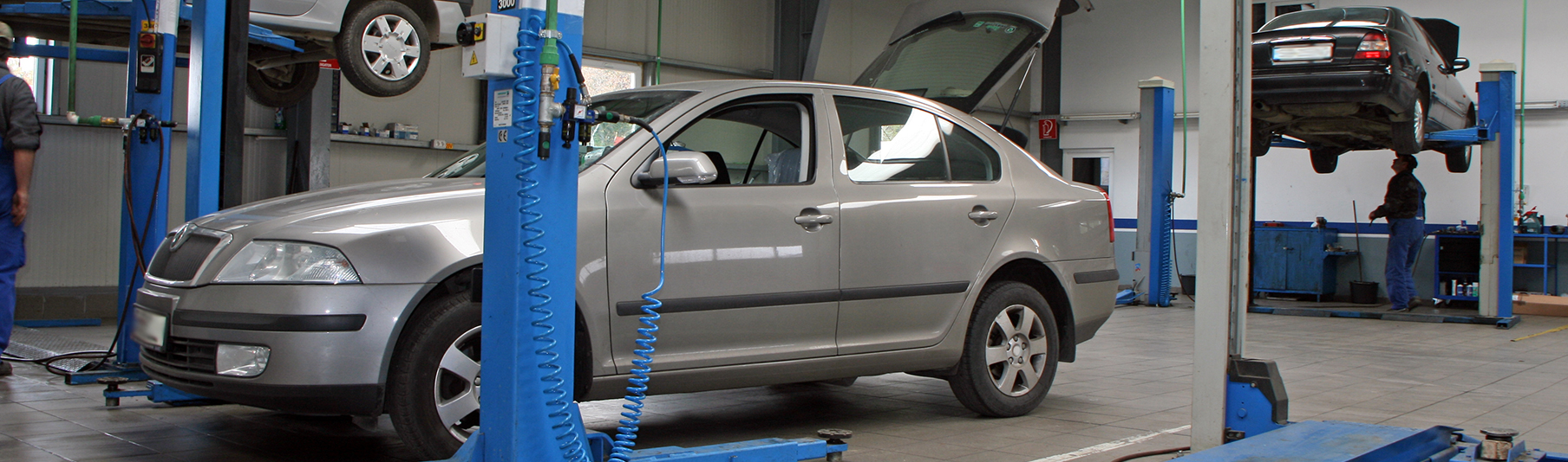 Motor Trade Insurance: A grey car inside a motor workshop