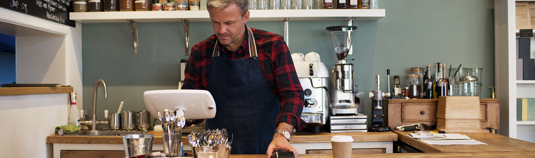 Retail Insurance: An employee working behind the counter of a cafe